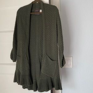 Adorable Anthropologie long knit green cardigan with ruffled hem.